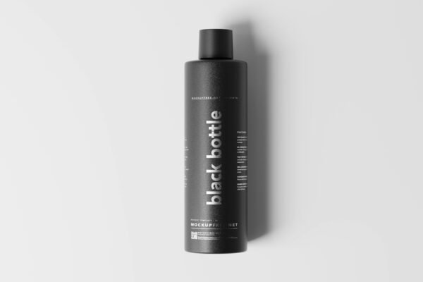 a bottle of black shampoo on a white surface